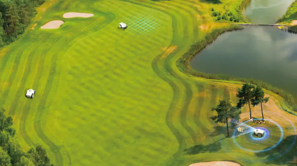 Multiple FJD FRX robotic mowers operating on a golf course fairway