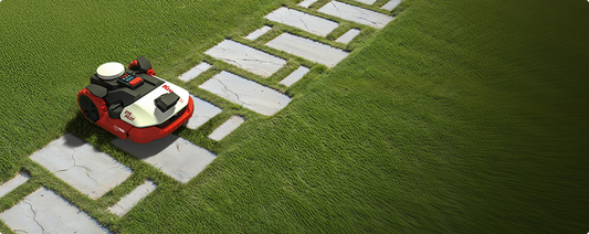 Kress EyePilot robotic mower crossing stepping-stone pavers set into a lawn while navigating paths and edges