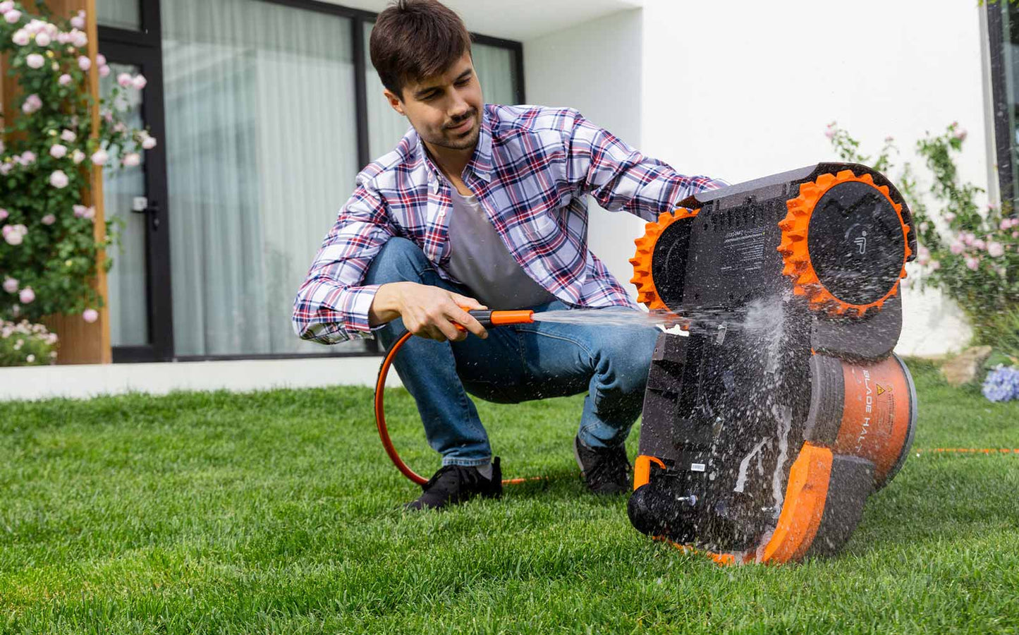 washing off the robot mower