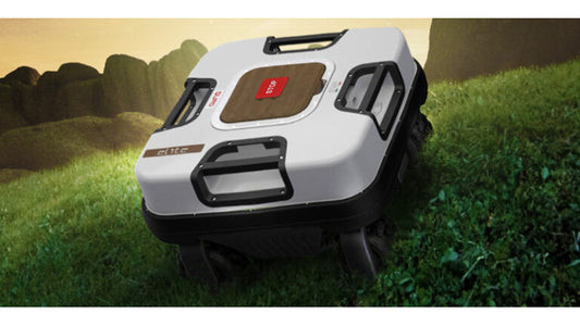 Ambrogio Quad Elite robotic lawnmower on a grassy field