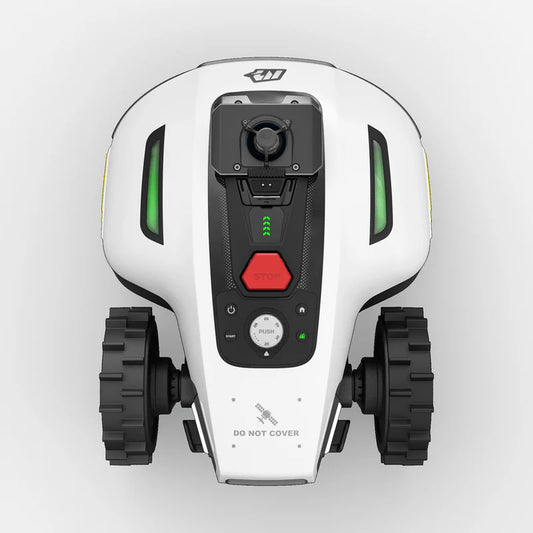 Top-down view of a white robot with black wheels and red button on a light gray background