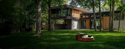 Kress EyePilot robotic mower mowing a shaded lawn among tall trees in front of a modern home